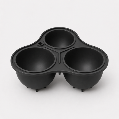 Charcoal three-compartment mould on a light gray background