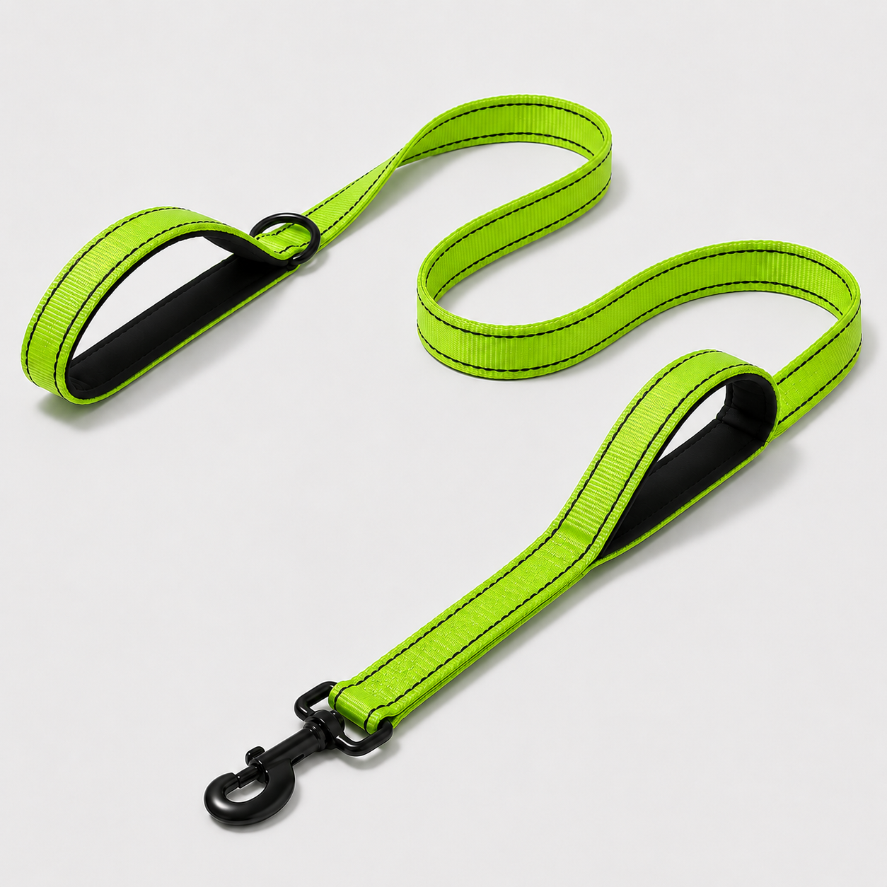 Lime green dog leash with black clip on a light grey background