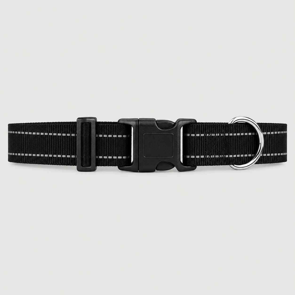 Black dog collar with reflective strip on a light grey background