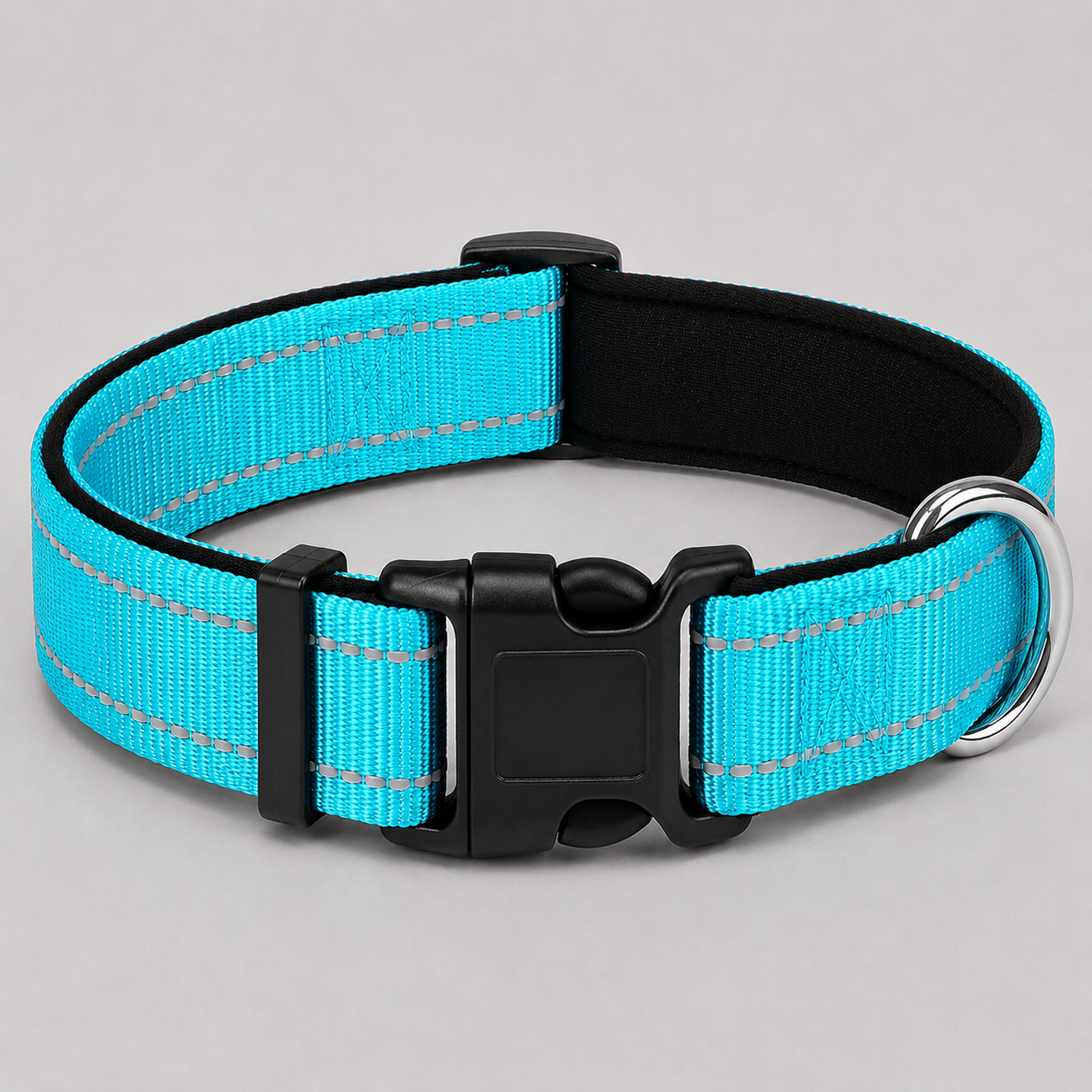 Cyan blue dog collar with black hardware on a light grey background