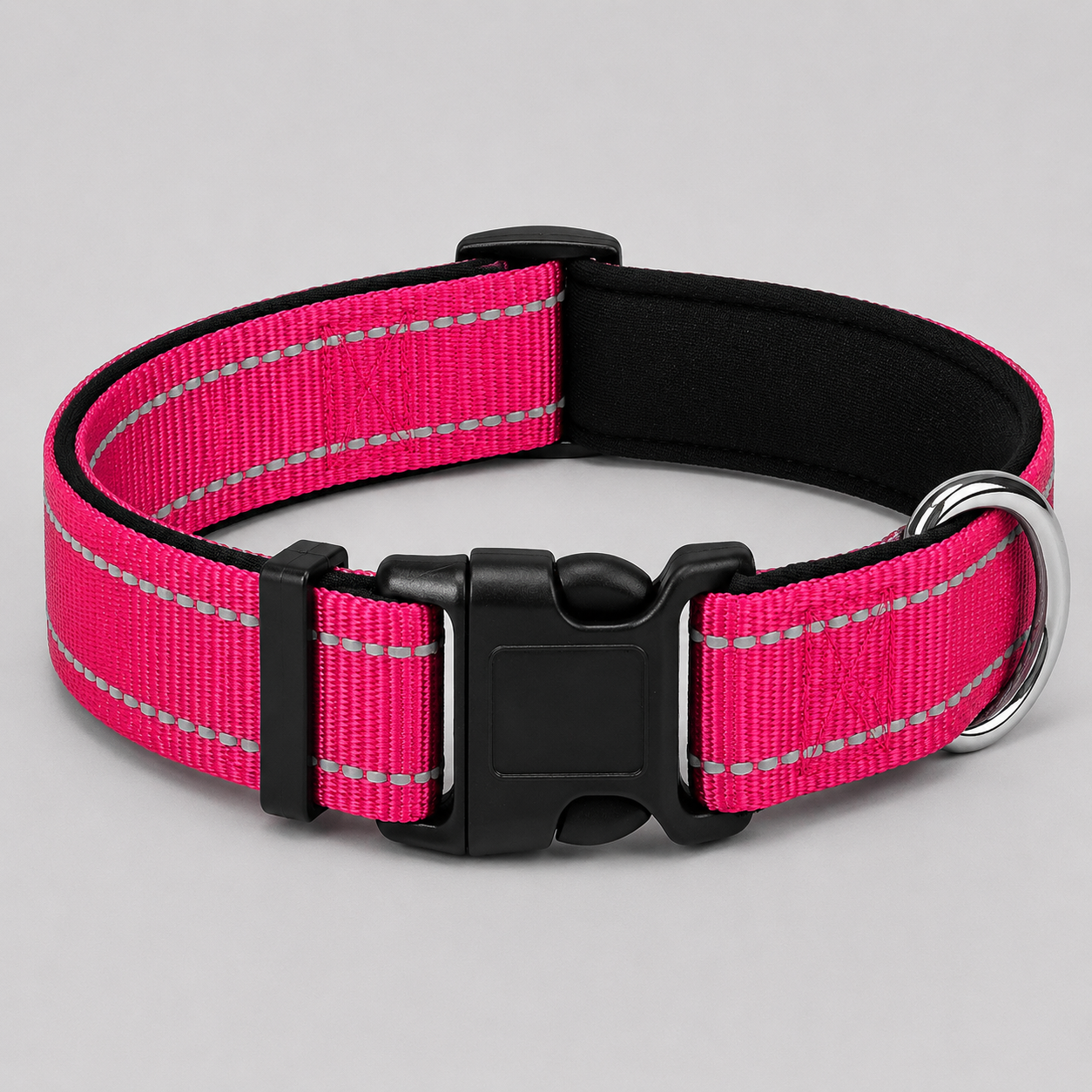 Rose pink dog collar with reflective stripes on a grey background