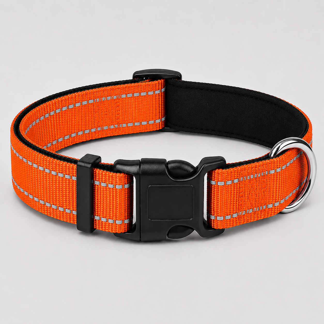 Orange dog collar with reflective stripes on a light grey background