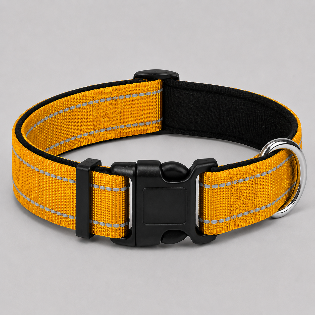 Yellow dog collar with reflective stripes and a black buckle on a grey background