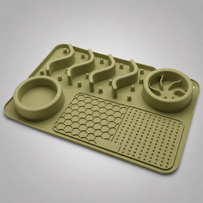 Green silicone mat with pet feeding and drinking components on a grey background