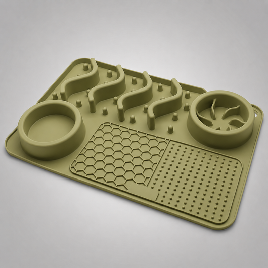 Green silicone mat with pet feeding and drinking components on a grey background