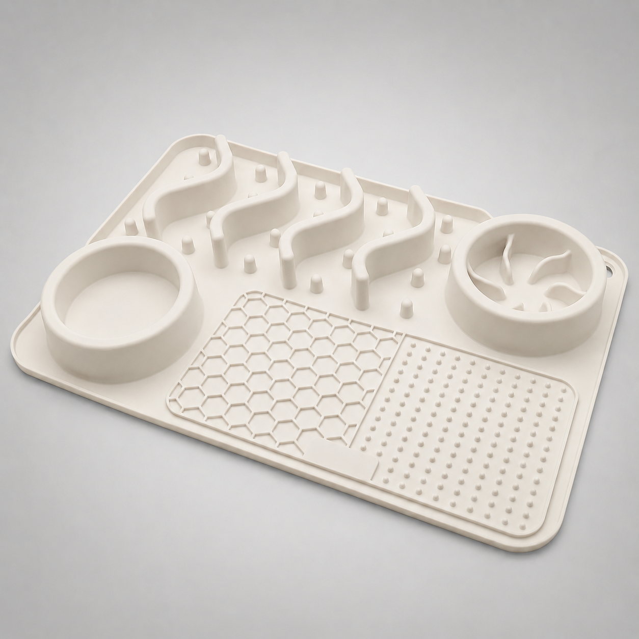 White silicone mat with pet feeding and water bowls on a gray background
