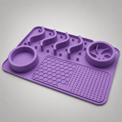 Purple silicone mat and bowls with textured design on a grey background