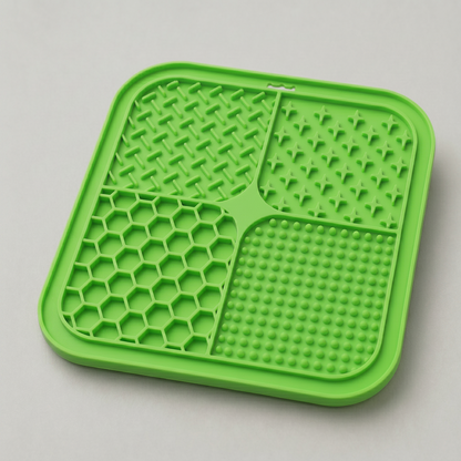 Lime Green dog lick silicone mat with textured surface on a light gray background