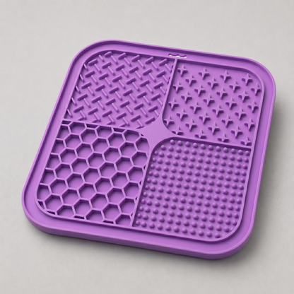 Purple dog lick silicone mat with textured surface on a light gray background