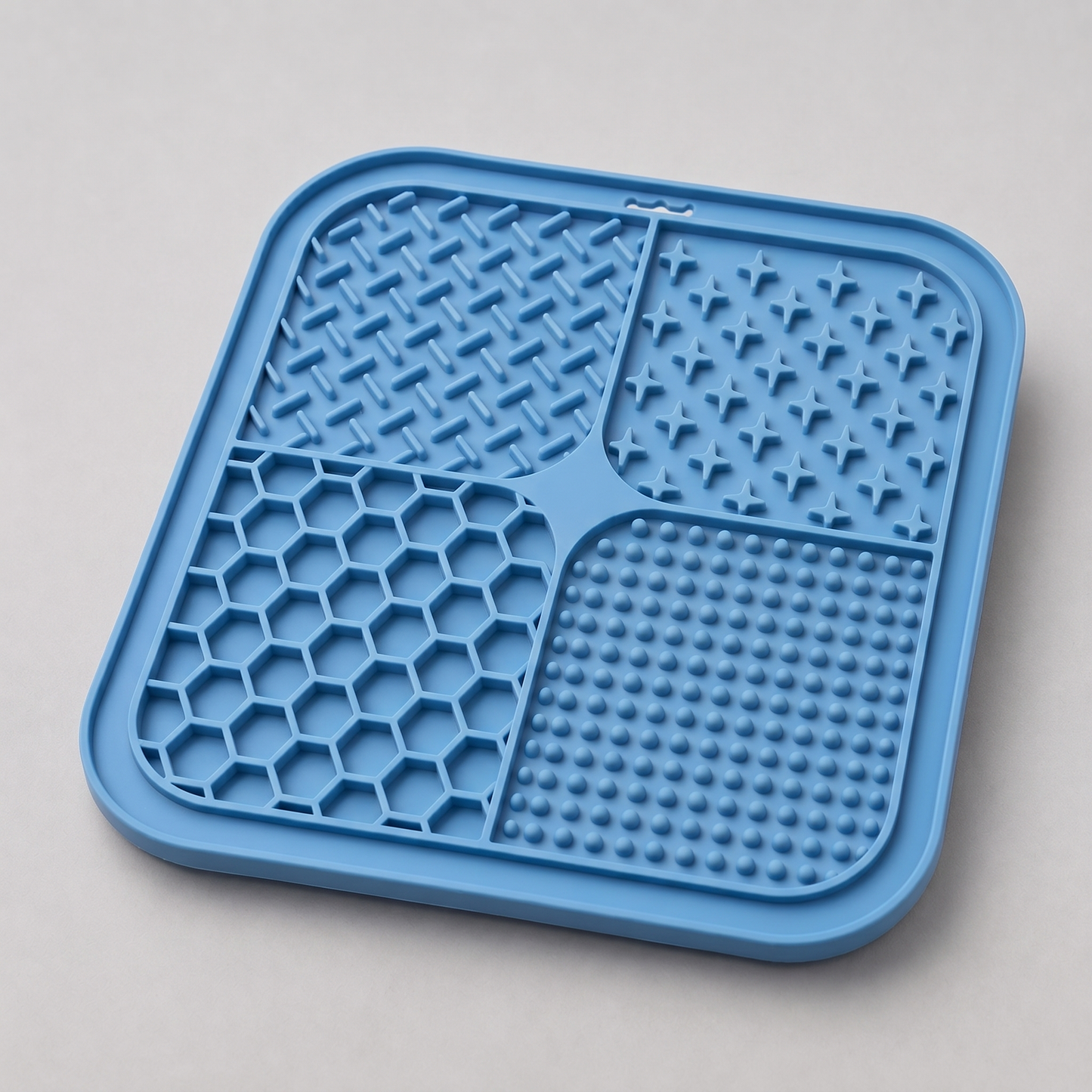 Steel Blue dog lick silicone mat with textured surface on a light gray background