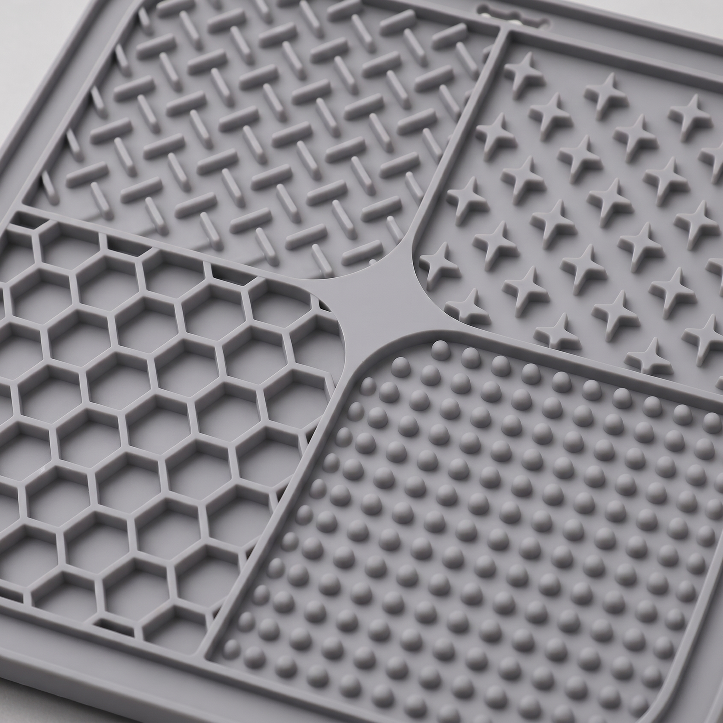 Grey dog lick textured mat with various patterns