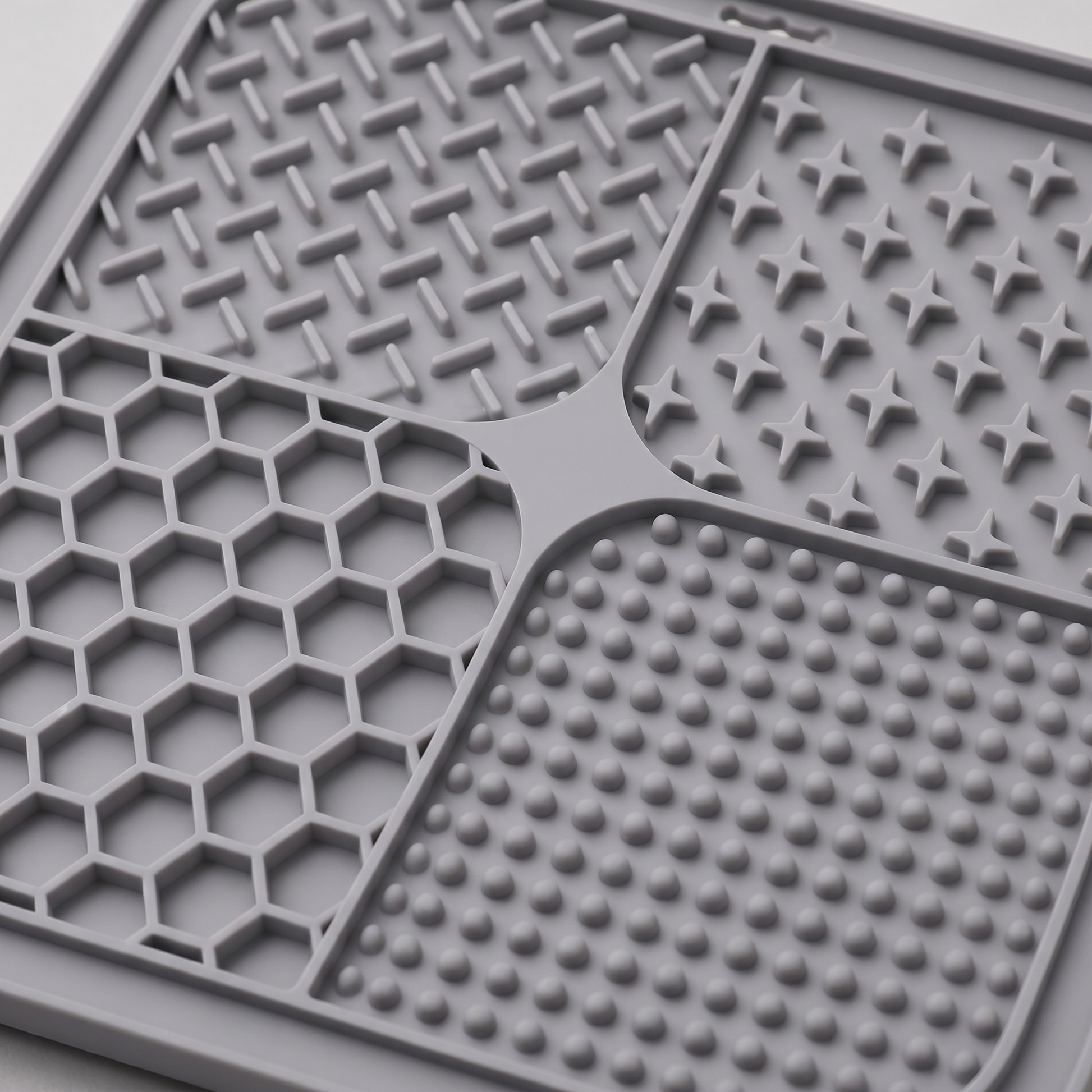 Grey dog lick textured mat with various patterns