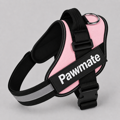 Pink dog harness with black straps and reflective material on a gray background