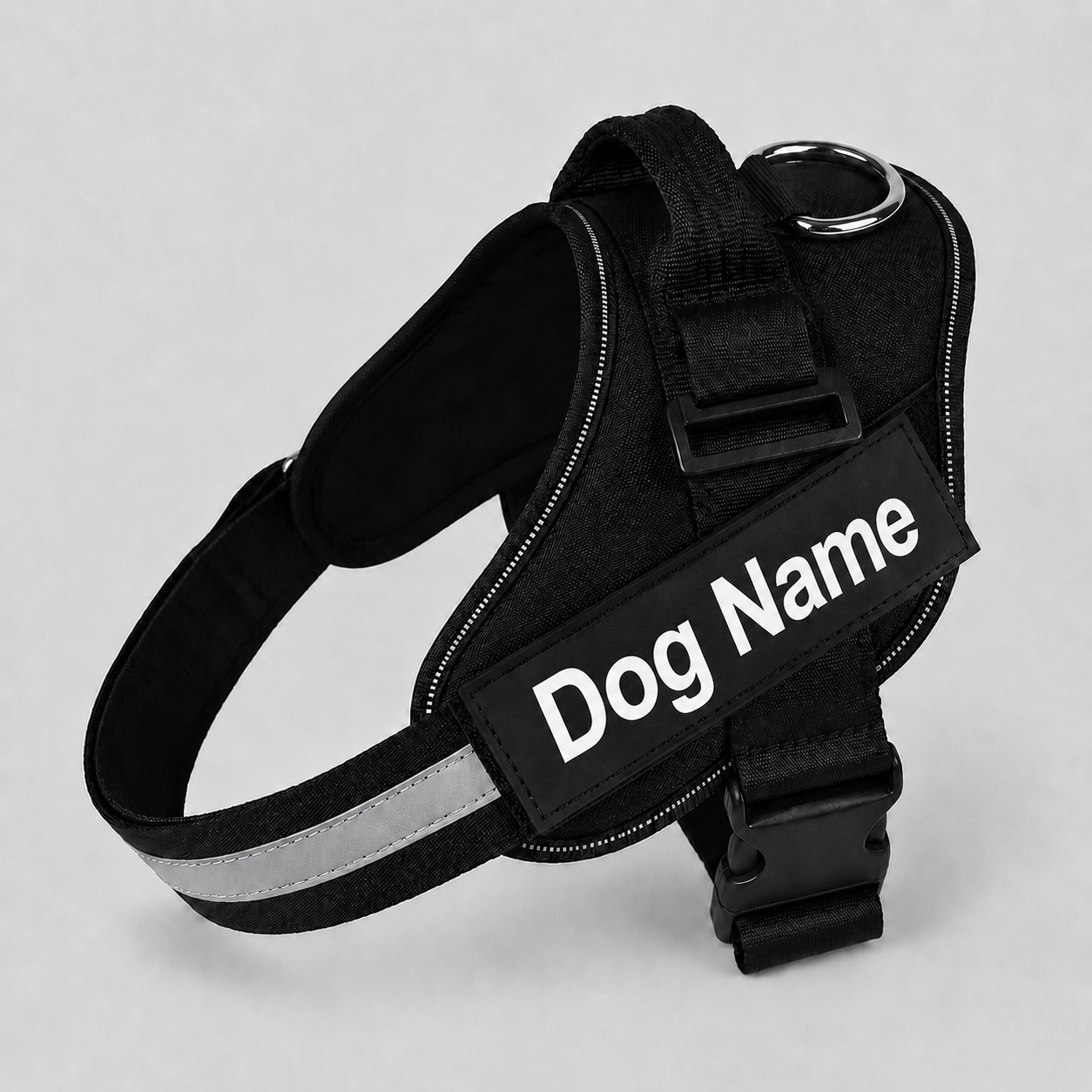 Black dog harness with 'Dog Name' label on a light grey background
