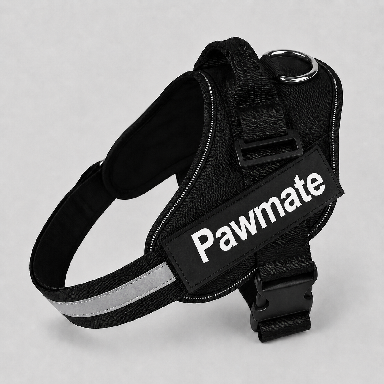 Black dog harness with reflective strip on a gray background