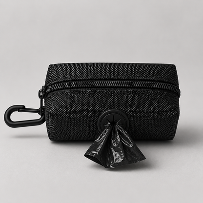 Black waste bag holder with a plastic bag attached on a light gray background