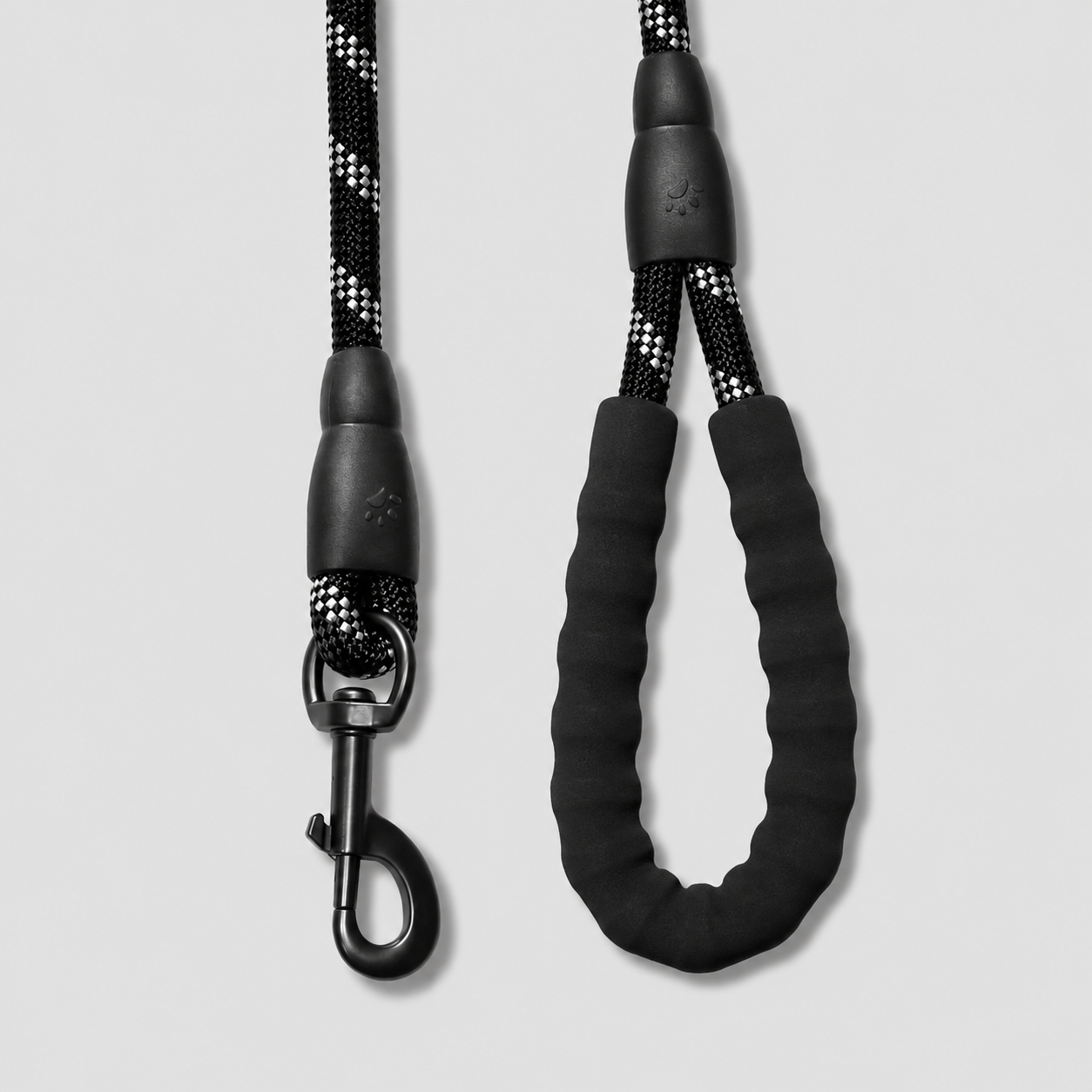Black dog leash with a clip on a light gray background