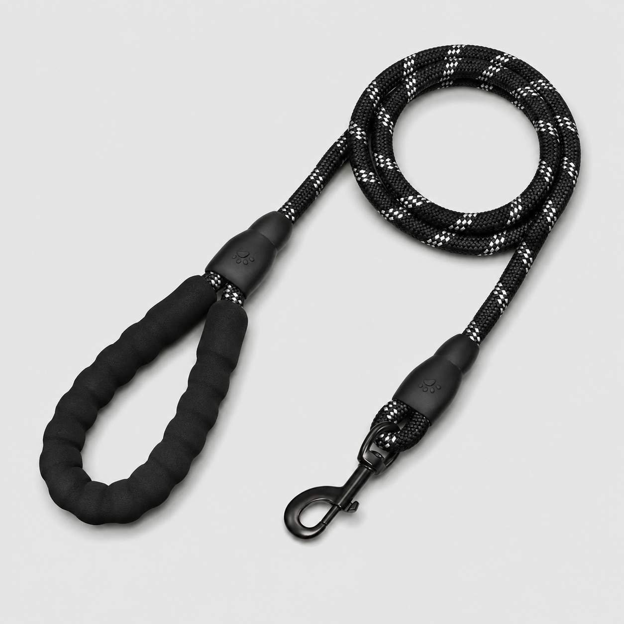Black dog leash with reflective pattern on a light gray background