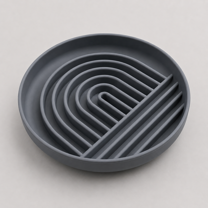 Charcoal dog slow feeder bowl with wavy design on a light gray background
