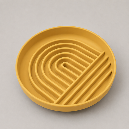 Tumeric dog slow feeder bowl with a wavy pattern on a gray background