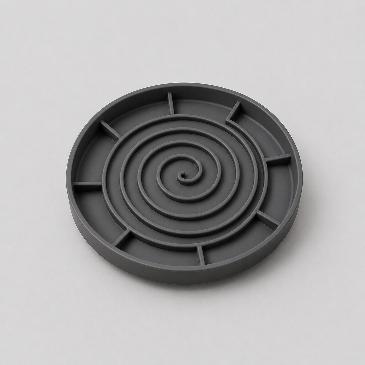 Grey silicone slow feeder dog bowl on a light grey background