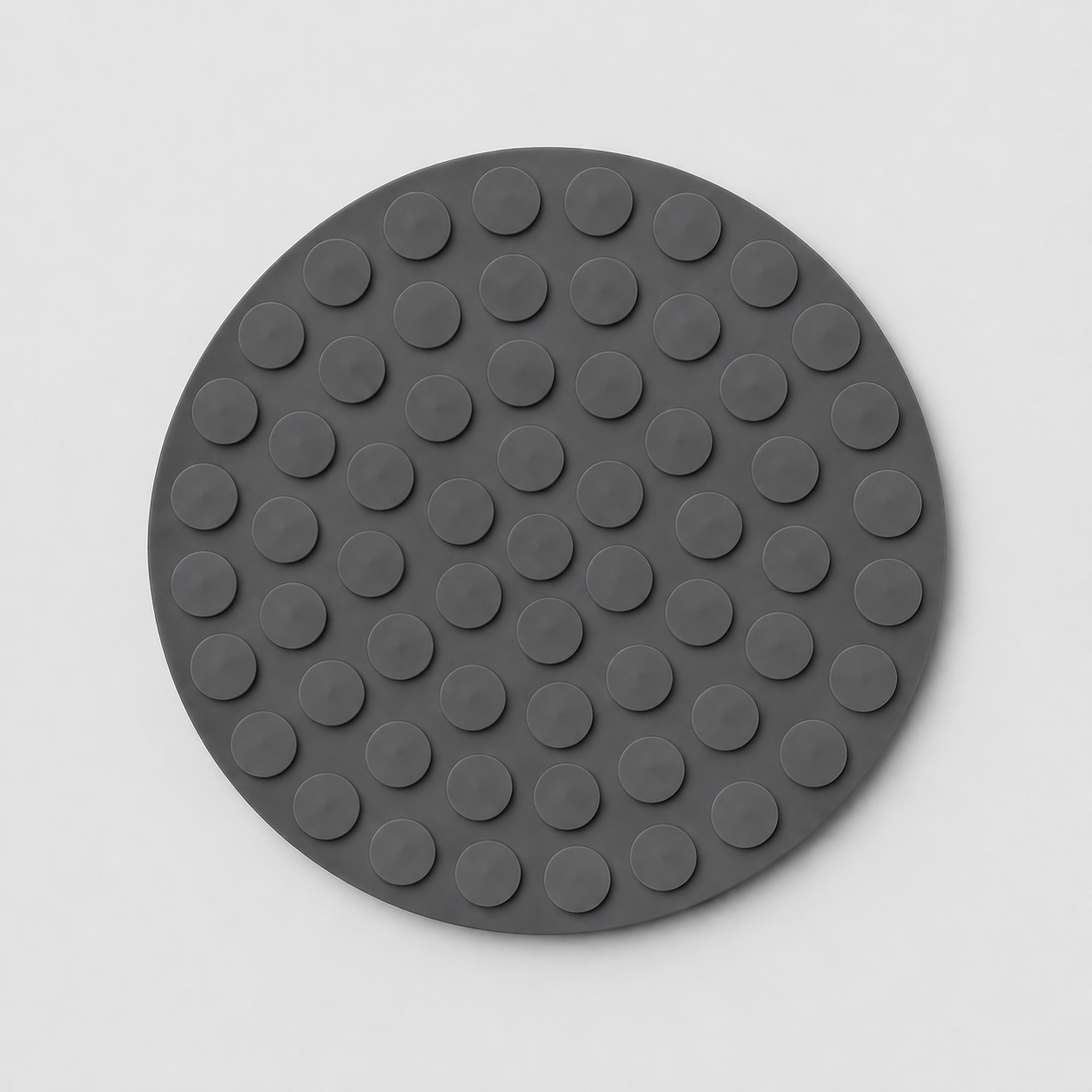 Grey silicone slow feeder dog bowl underside with suction cups on a light grey background