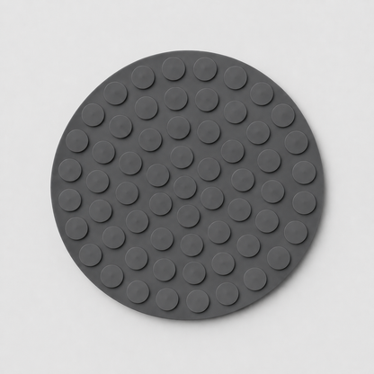 Grey silicone slow feeder dog bowl underside with suction cups on a light grey background